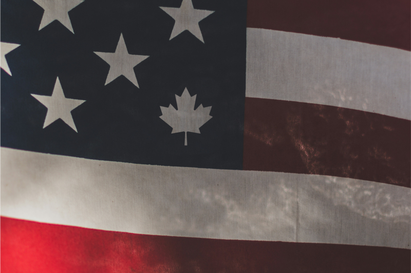 Zoomed in image of the USA flag, with one star replaced by a maple leaf
